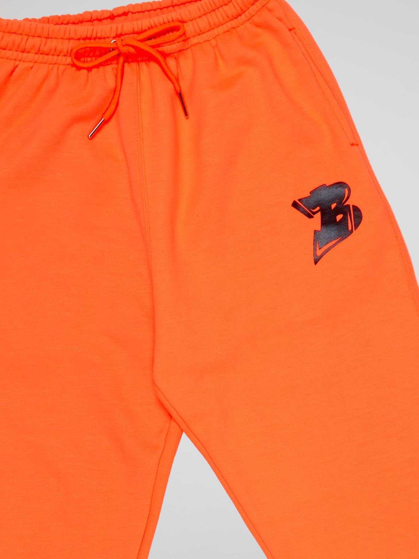 NEON ORANGE PANTS BHYPE LOGO ESSENTIALS - B-Hype Society